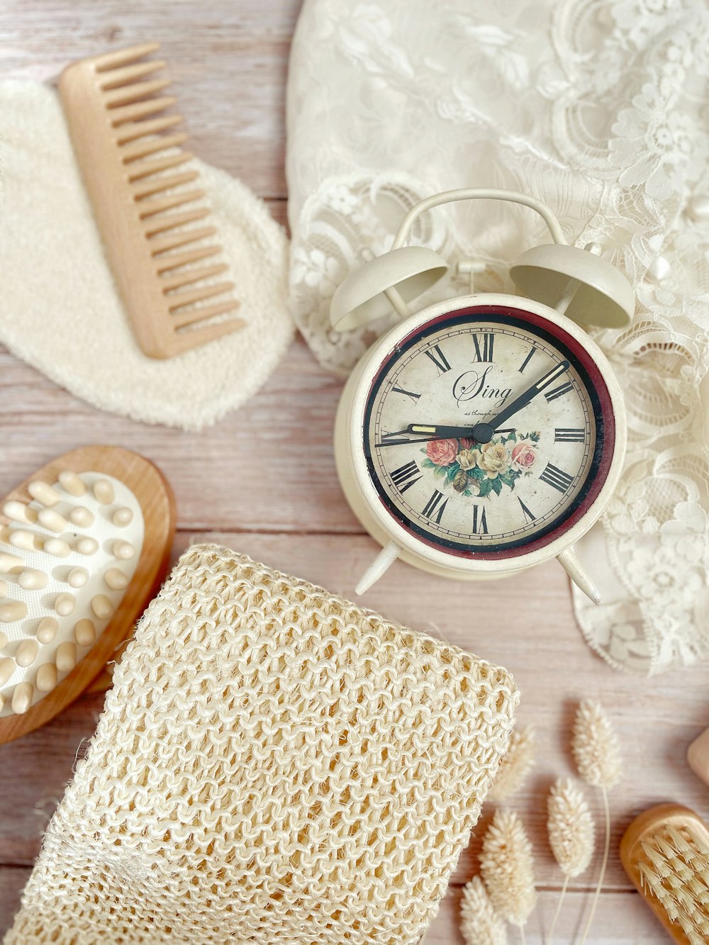 white round analog wall clock at 10 10