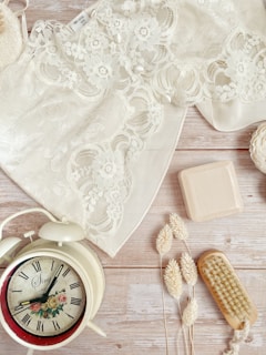 Elegant silk bonnet resting on a vintage wooden dresser
