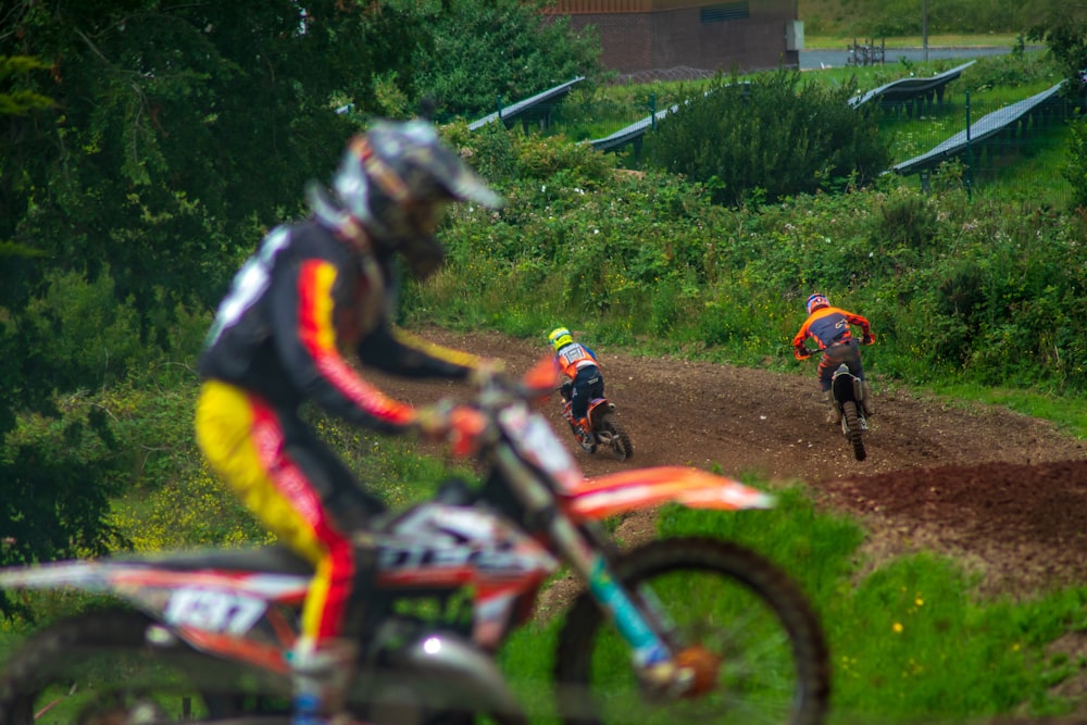 man in yellow and black jacket riding motocross dirt bike