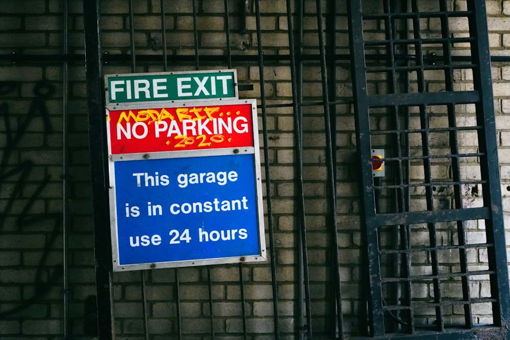 blue and white signage on black metal frame