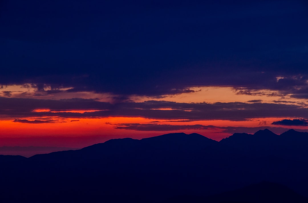 silhouette of mountains during sunset