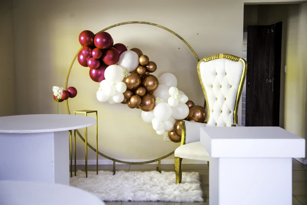 Elegant royal event setup with luxurious gold and white decorations in Abu Dhabi.