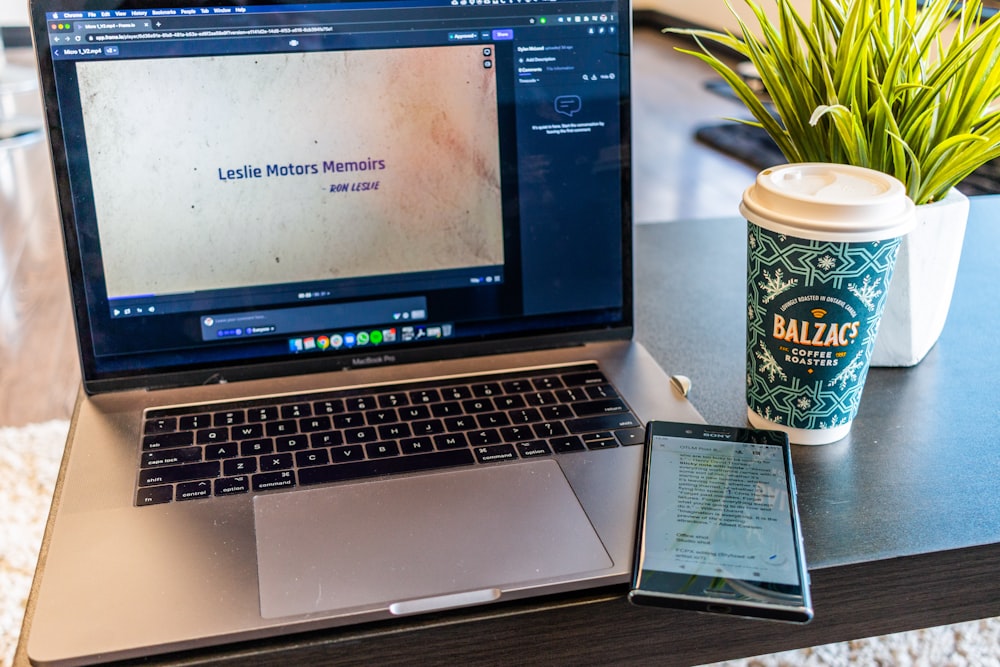 macbook pro on brown wooden table