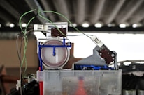 Close-up of electrical wiring and mechanical components being installed.