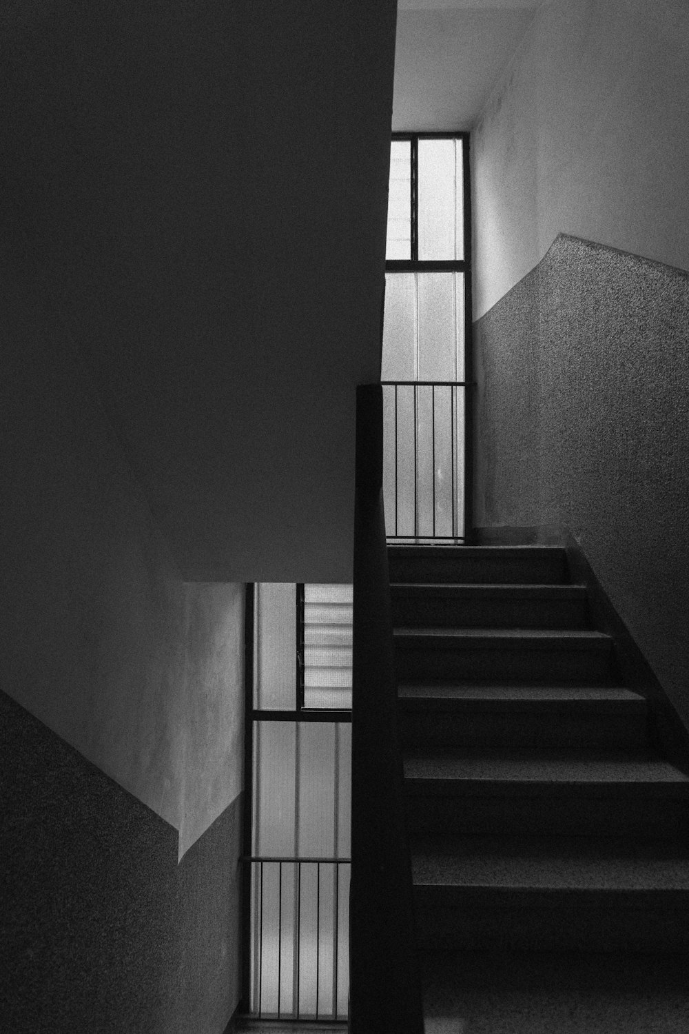 grayscale photo of staircase in a room