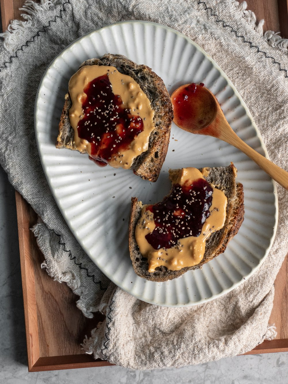 brown bread with chocolate syrup on white paper plate