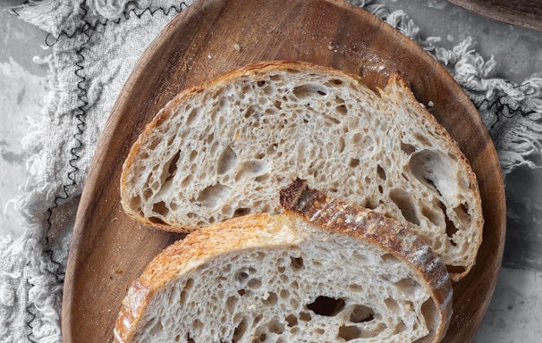 bread on brown wooden round tray