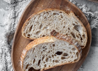 bread on brown wooden round tray