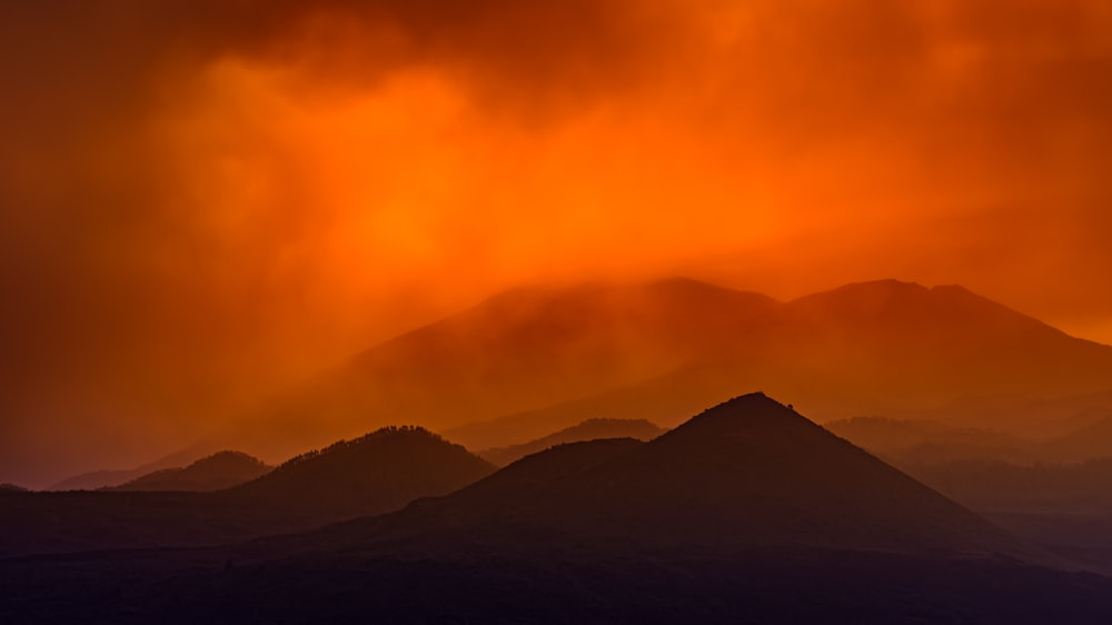 silhouette of mountains during sunset