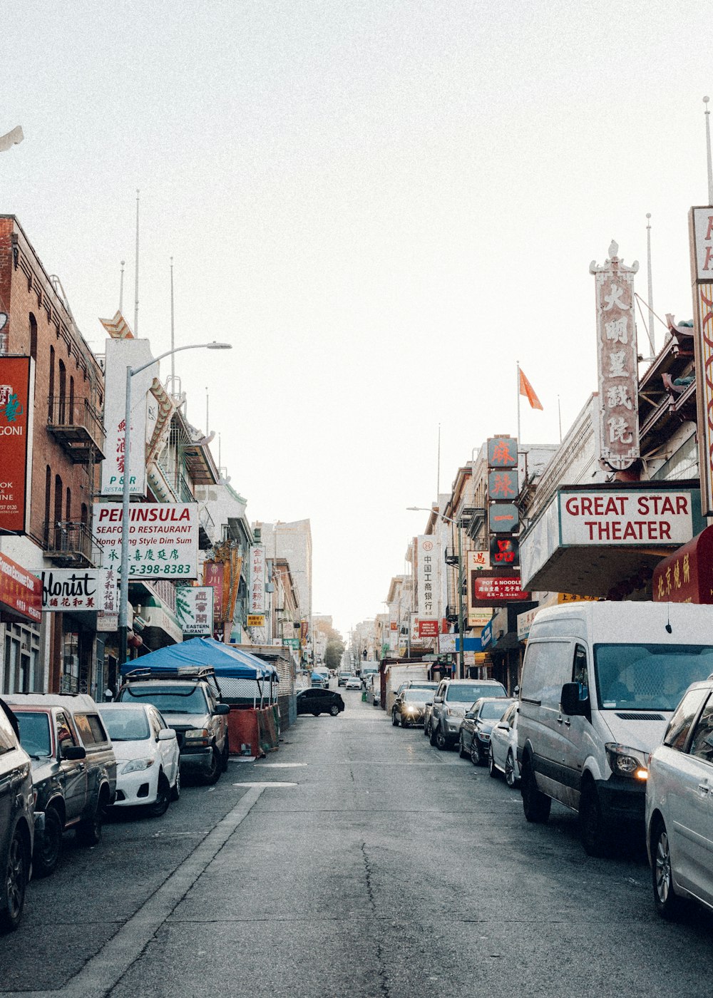 cars parked on street near buildings during daytime