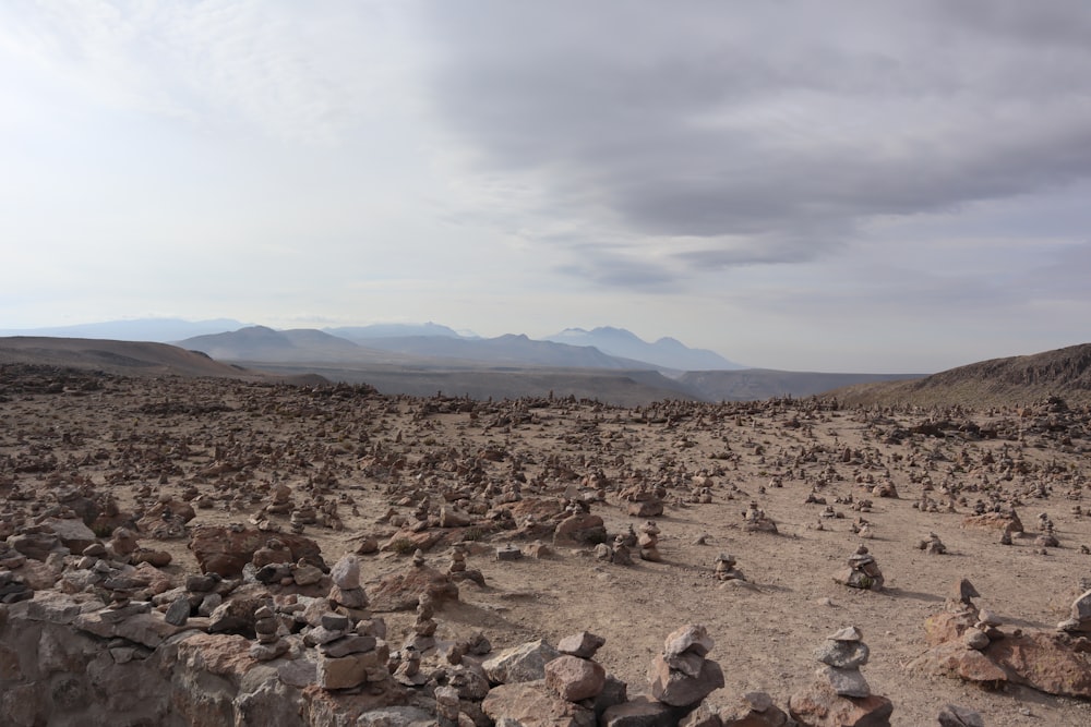 people sitting on rock formation during daytime