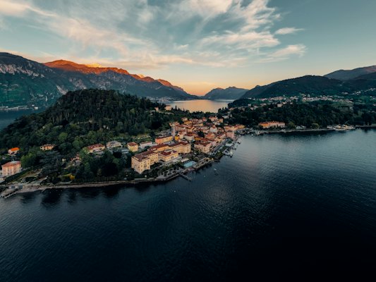 Aerial view of city near body of water during daytime — Lake Como, Italy