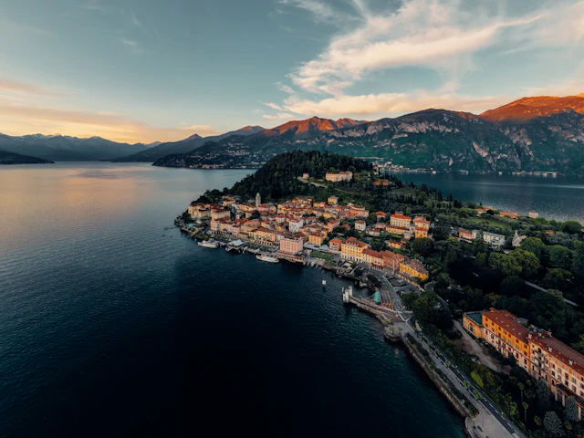 Aerial view of a lakeside village and mountains on Lake Como