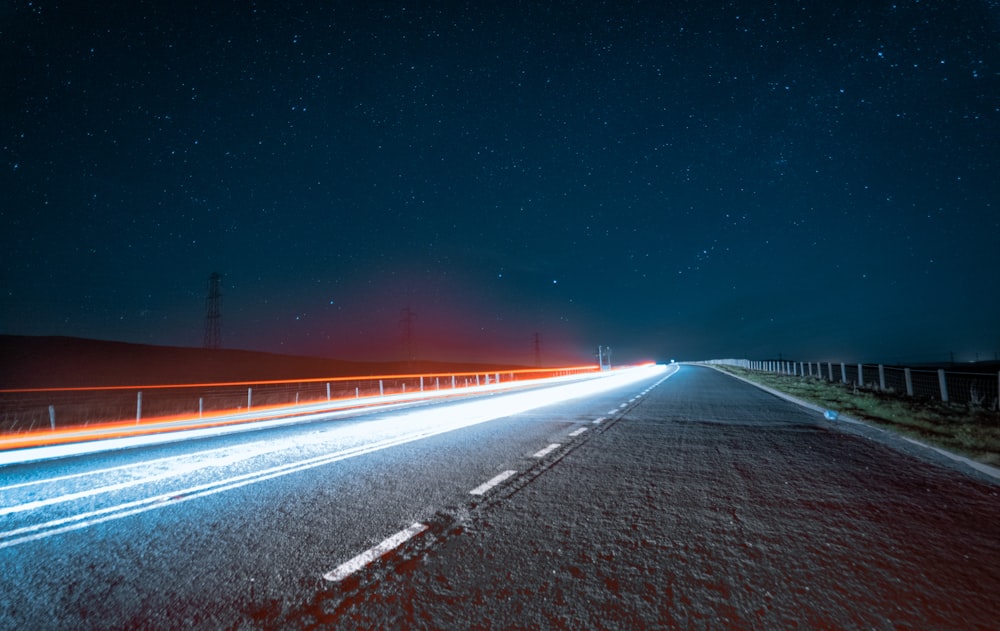 time lapse photography of road during night time