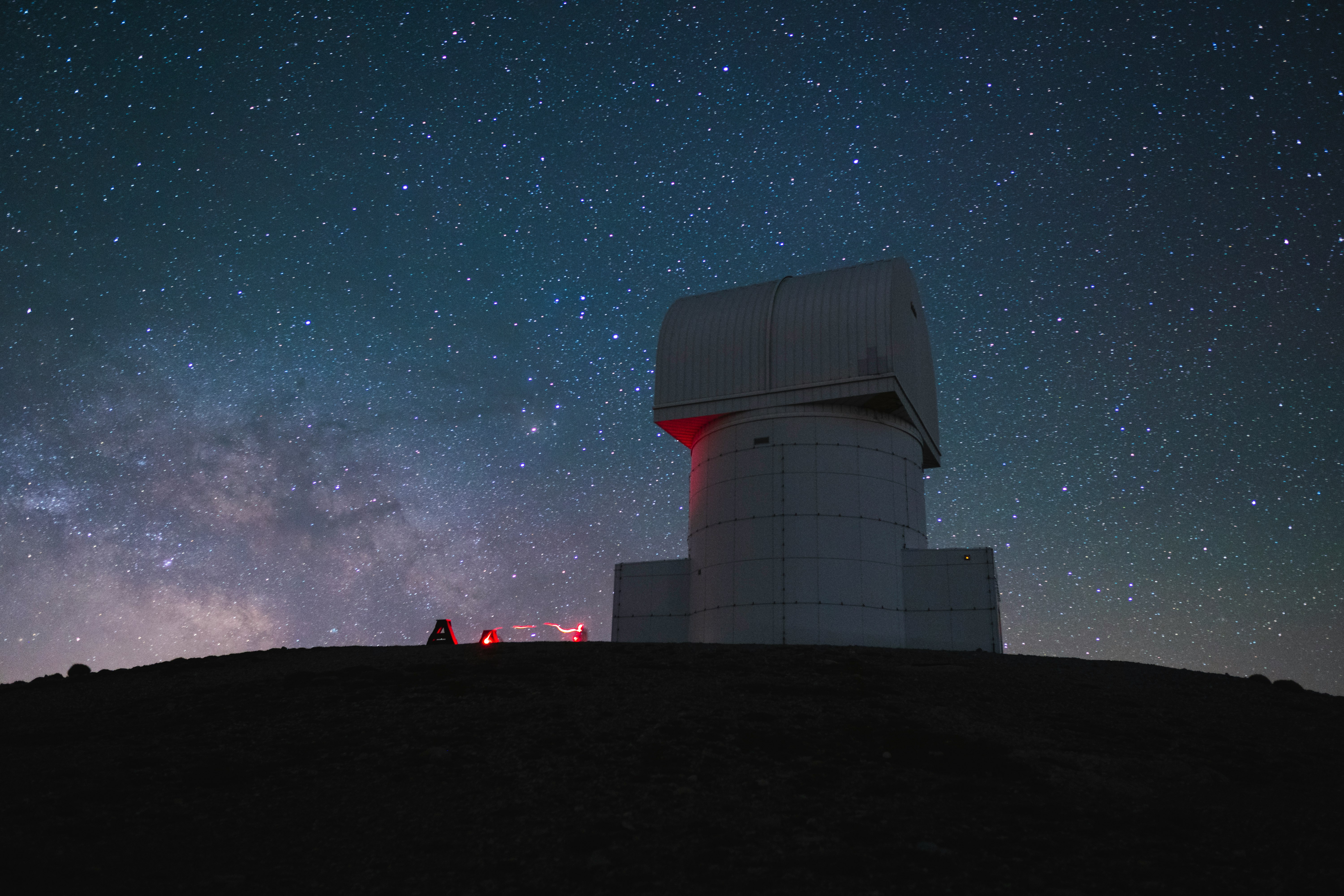 white and red building under starry night