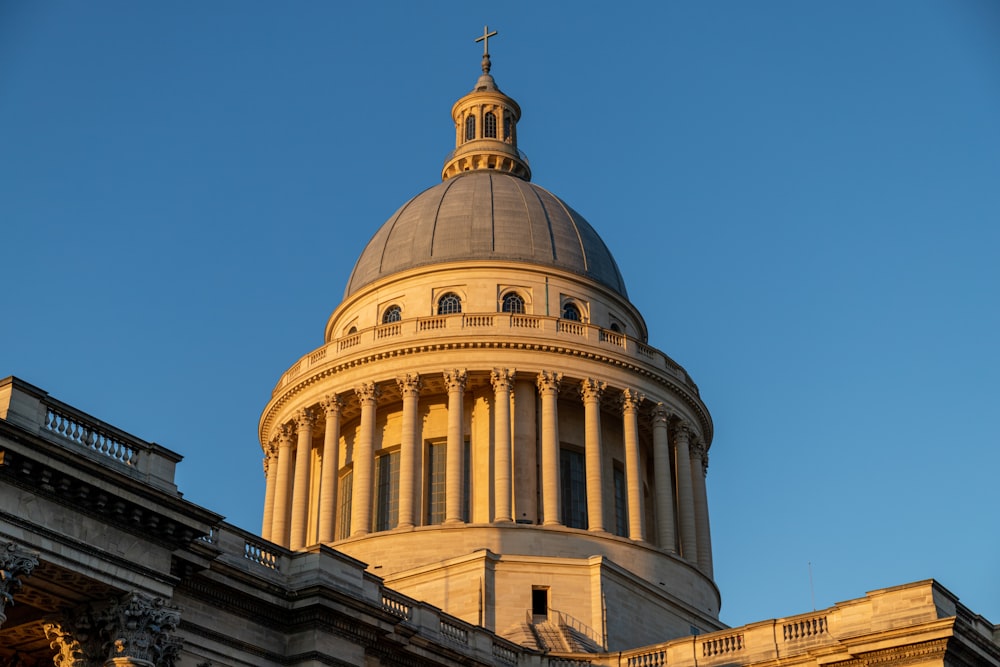 white concrete dome building under blue sky during daytime