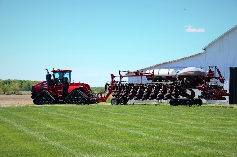 Modern agricultural machinery being used in a Libyan farm field