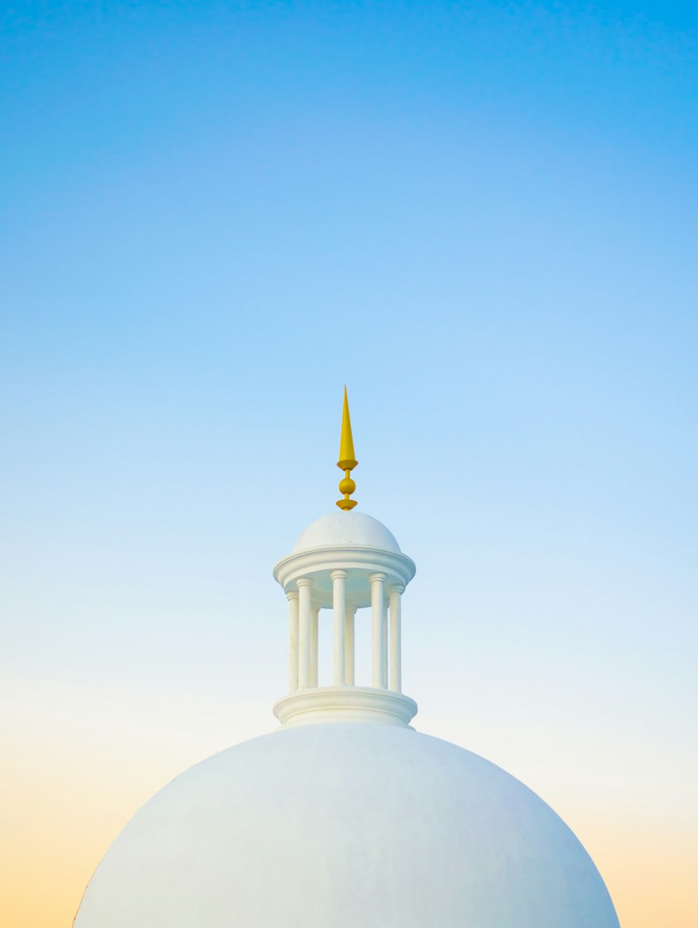 white dome building under blue sky during daytime