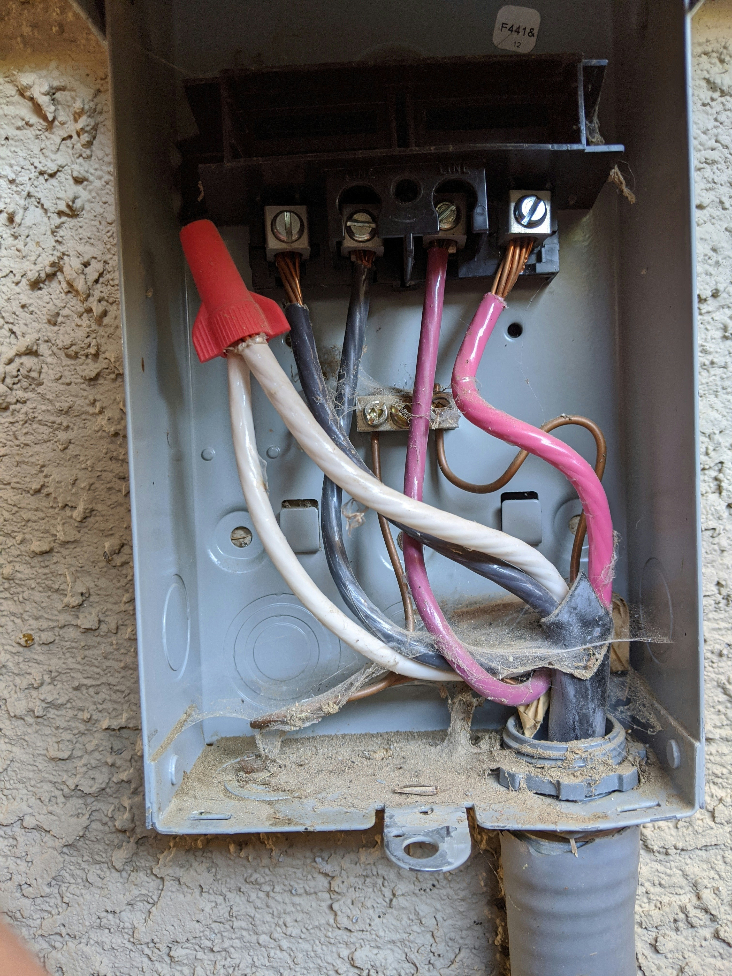 Close-up of electrical wiring and colorful cables being connected