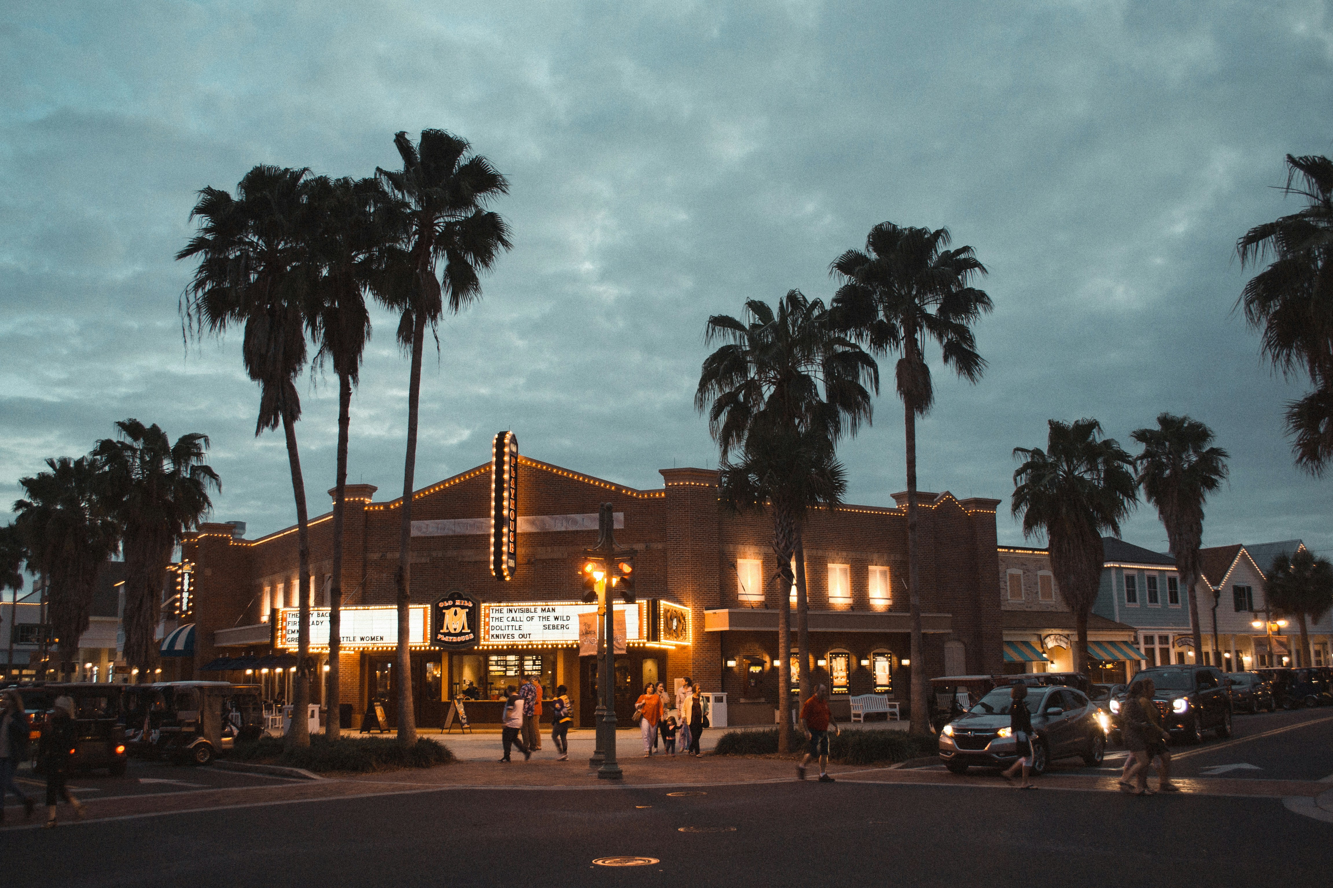 cars parked in front of building during night time