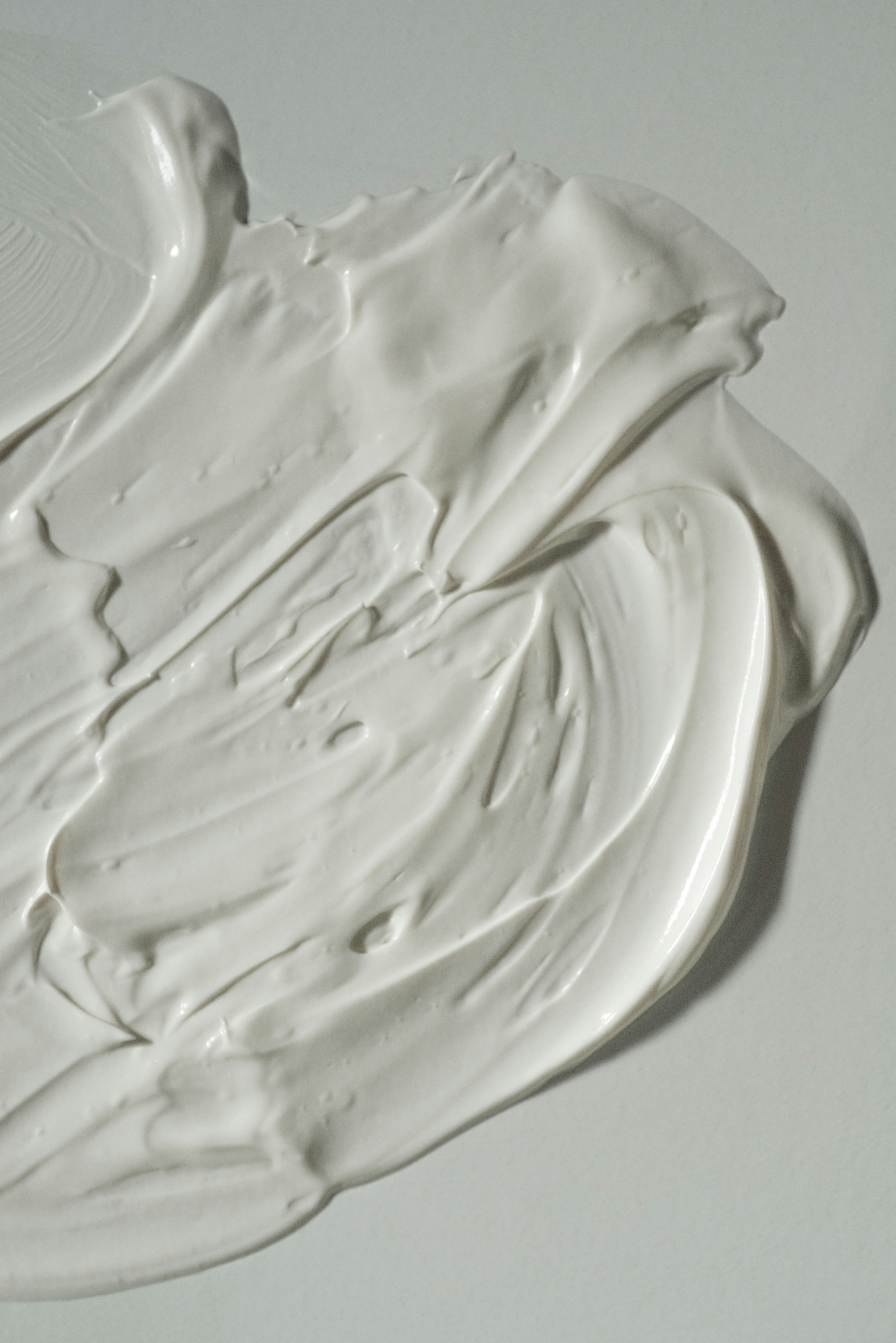 white ceramic bowl on white table