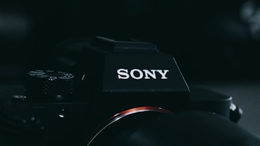 black nikon dslr camera on black background