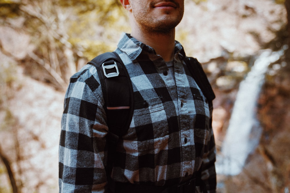 man in black and white plaid button up shirt