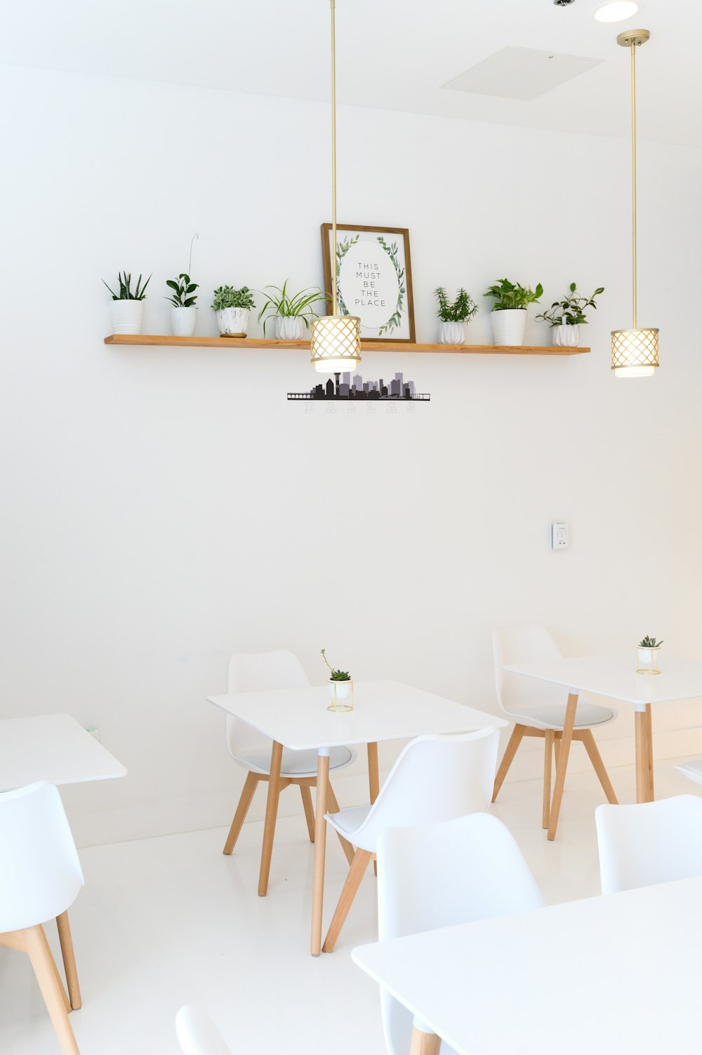 white table with chairs and table cloth