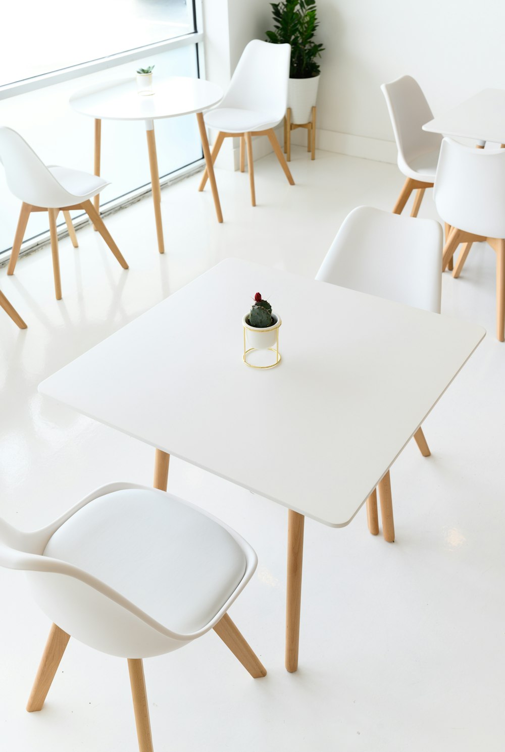 white wooden table with chairs