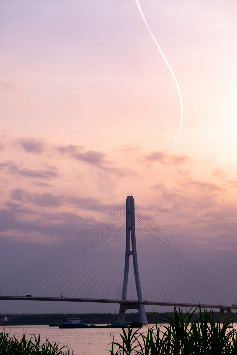 black bridge under white clouds