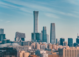 city skyline under blue sky during daytime