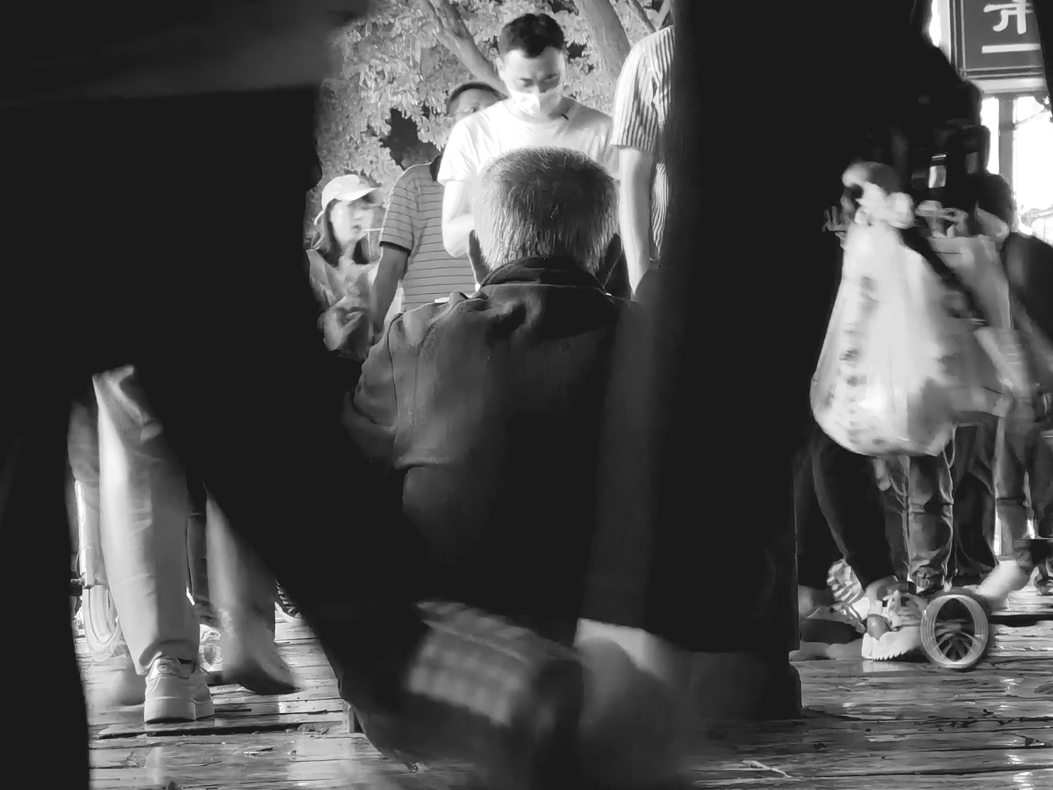 Man in Black Shirt Holding Hands with Woman in Black Dress