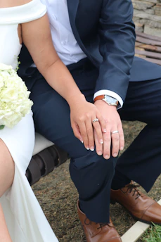 man in blue suit jacket and woman in white dress
