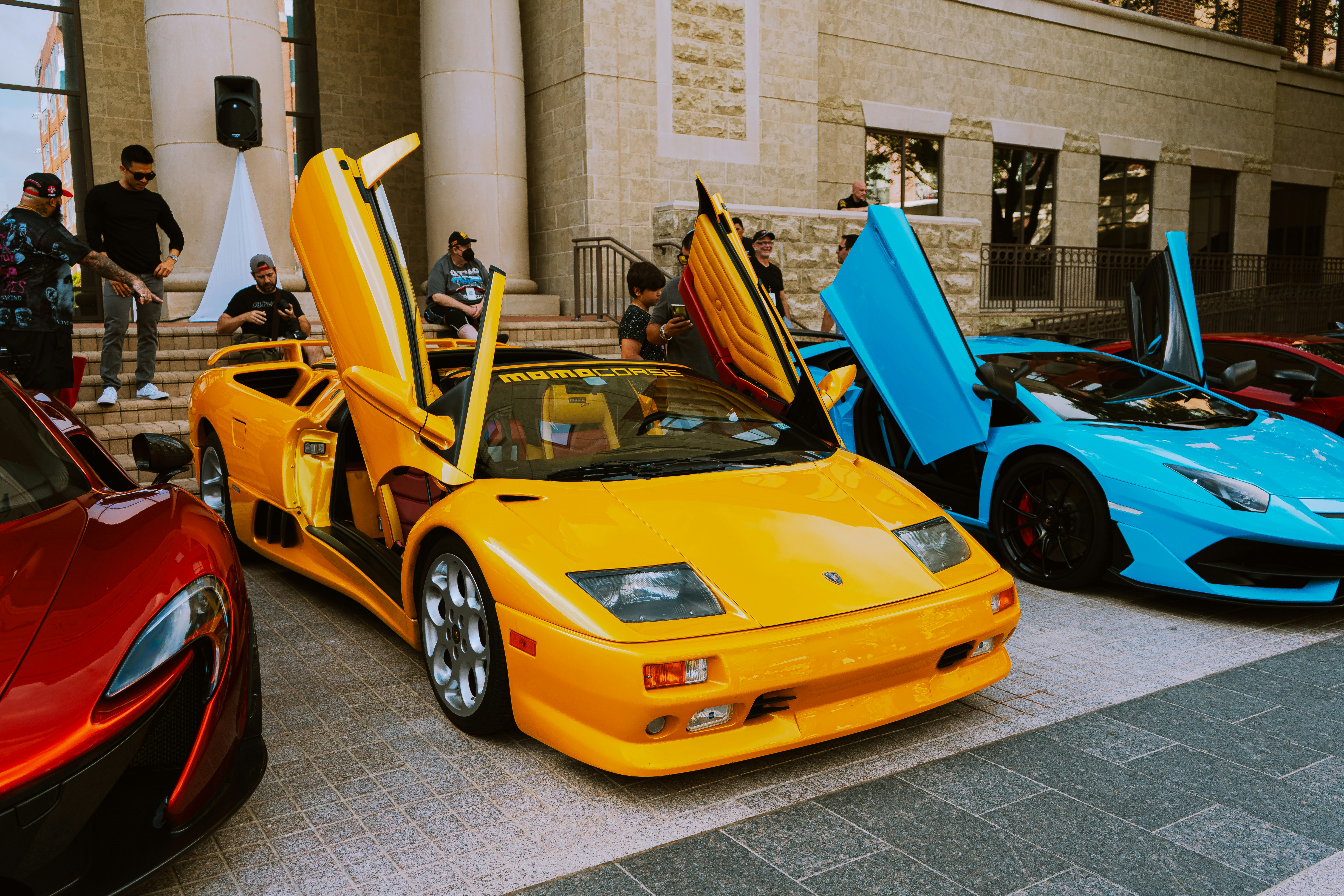 yellow ferrari 458 italia parked near building