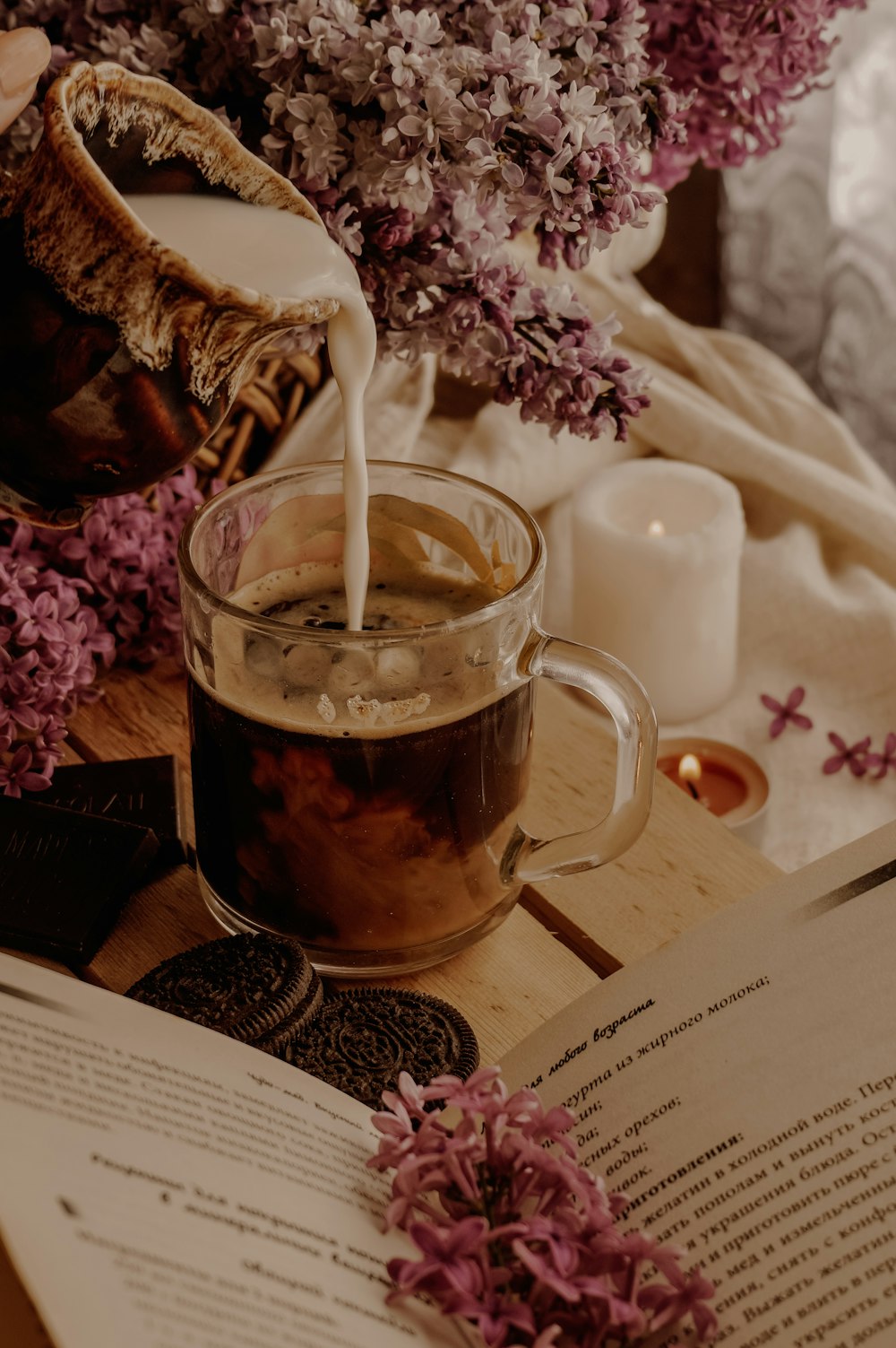 clear glass mug with brown liquid