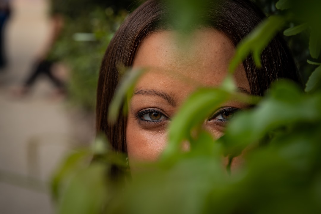 womans face on green leaves