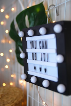 black and white sign that reads You Can Do It
