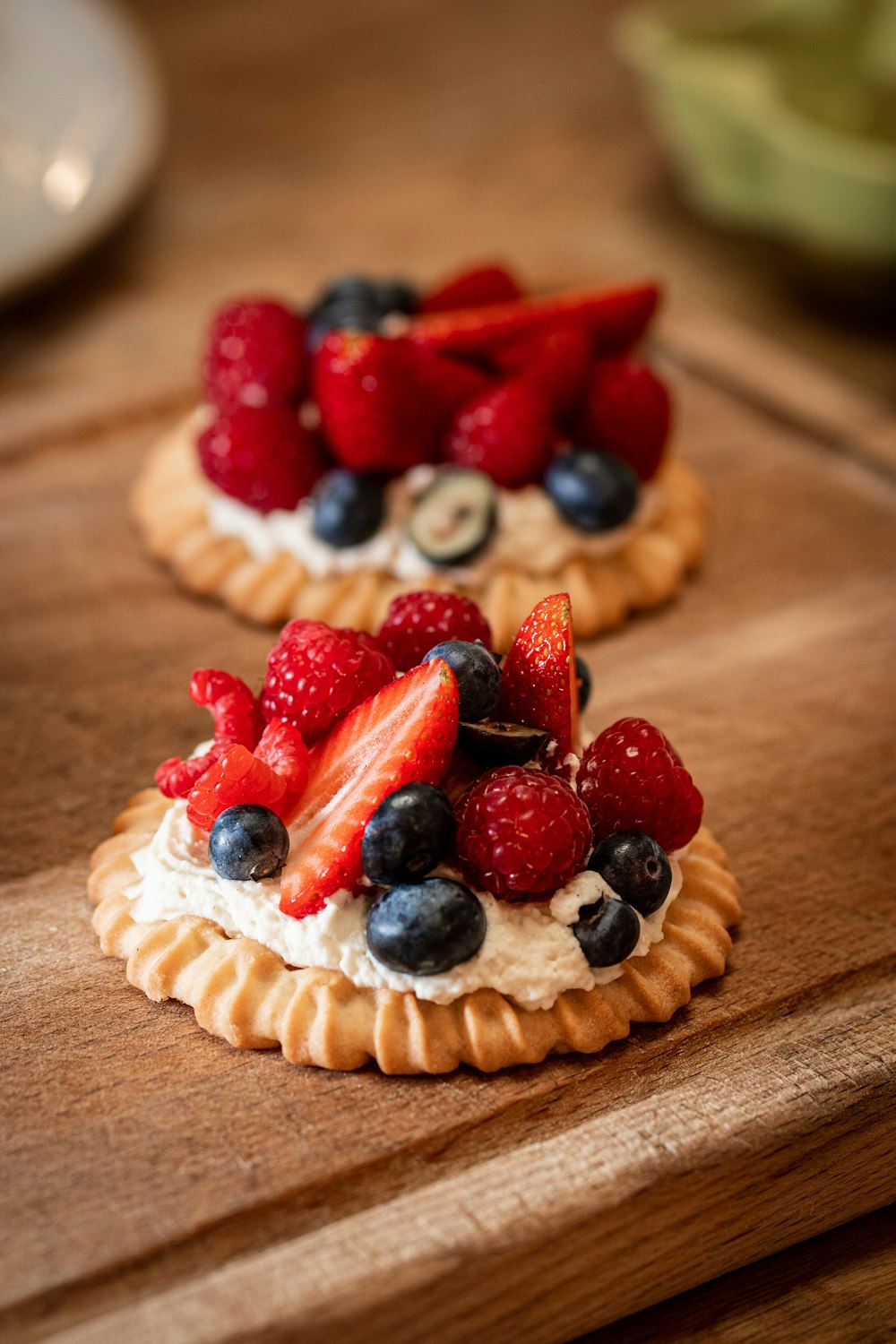 strawberry and blueberry pie on brown wooden table