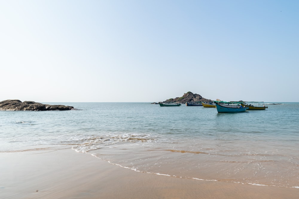 green boat on sea during daytime