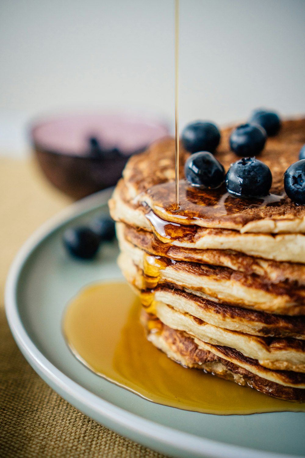 pancakes with blueberries on white ceramic plate