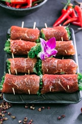 raw meat on green ceramic plate