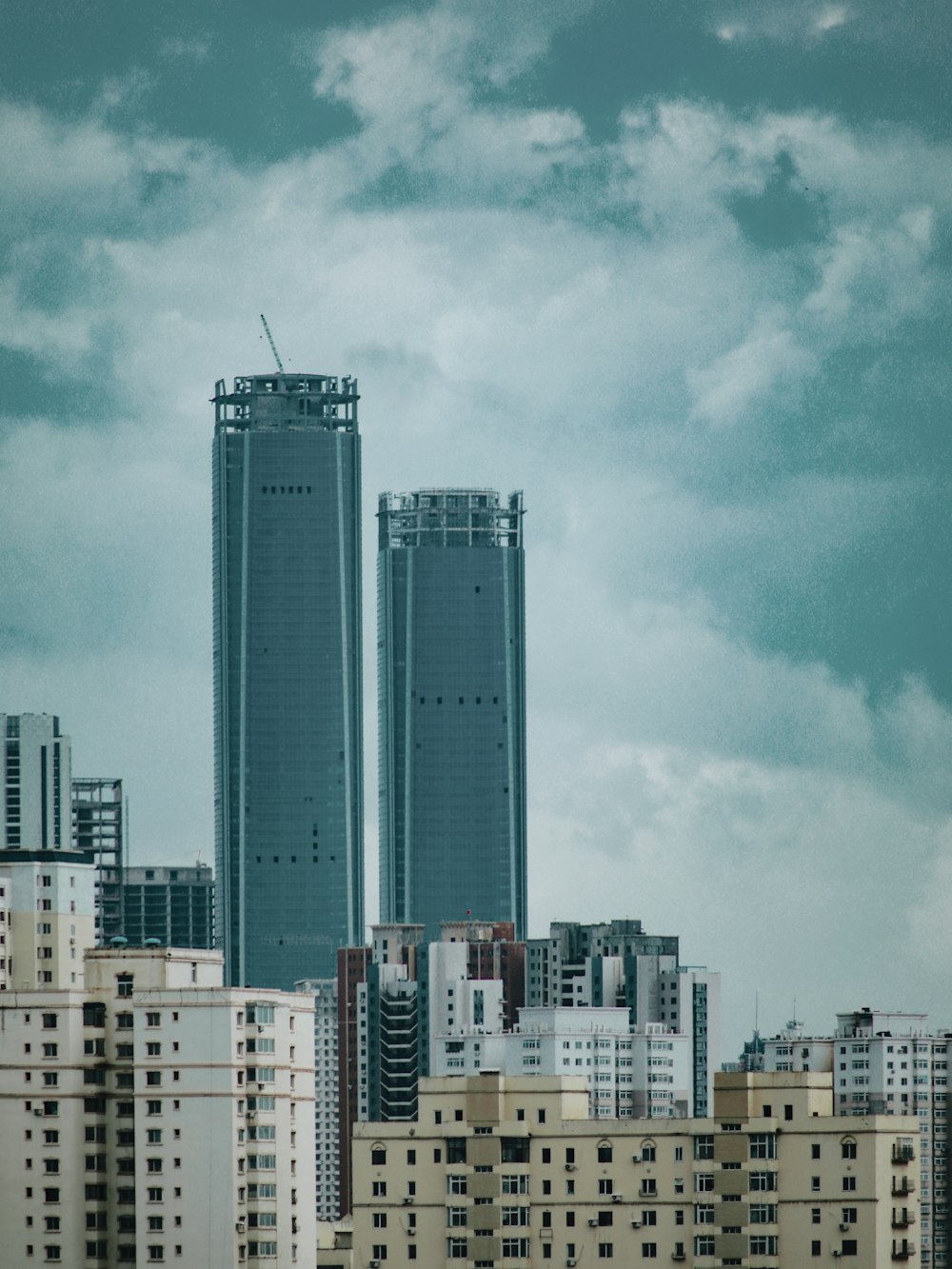 white and blue high rise buildings under blue sky during daytime