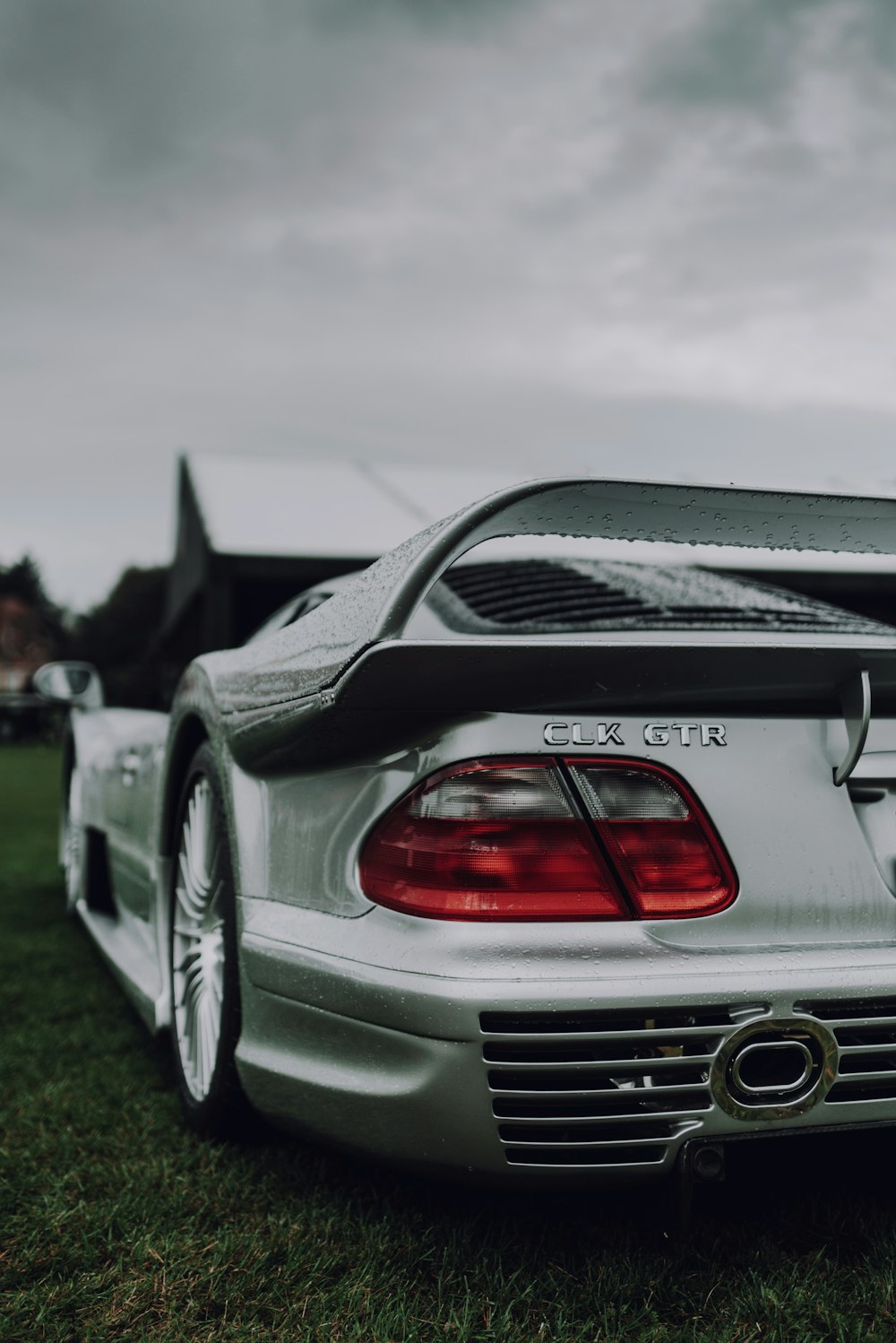 white bmw m 3 coupe on green grass field during daytime