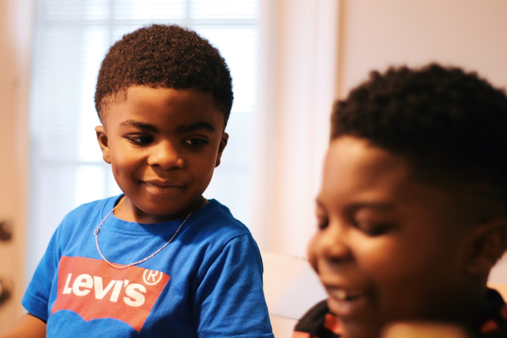 boy in blue crew neck shirt