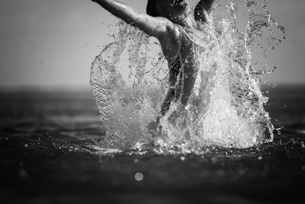 grayscale photo of woman in water