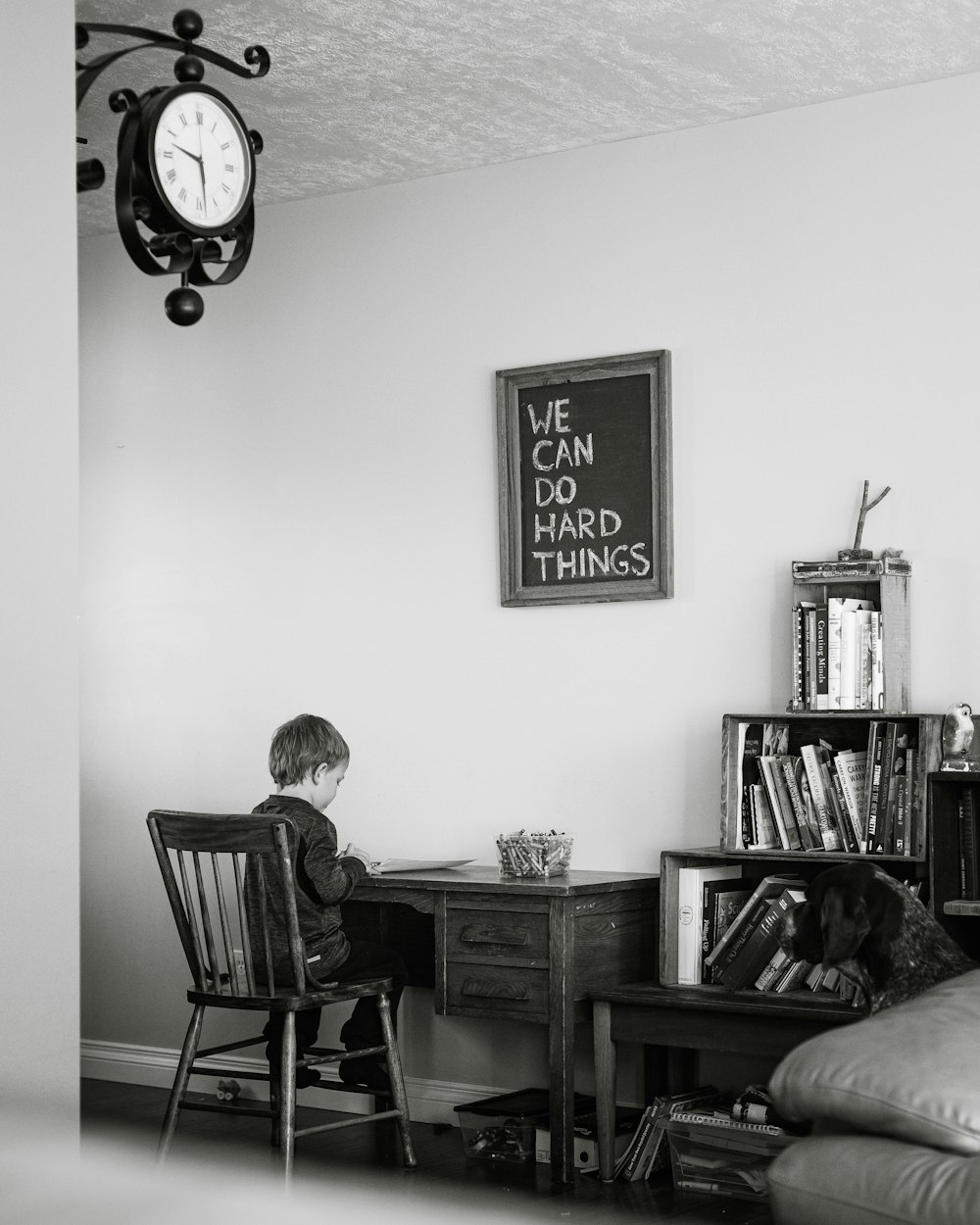 man and woman sitting on chair in front of table