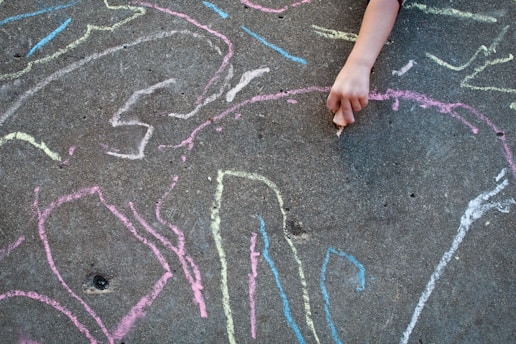 person standing on gray sand