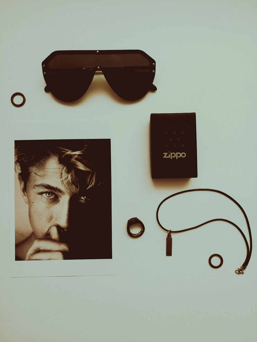 black framed sunglasses beside black box