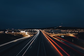 time lapse photography of cars on road during night time