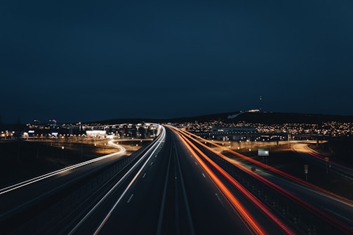 time lapse photography of cars on road during night time